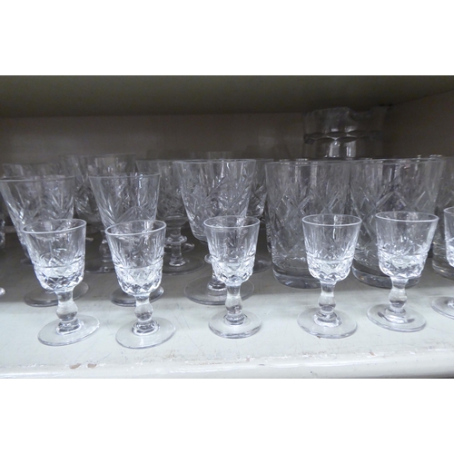 156 - Glassware: to include pedestal wines and tumblers with star cut decoration