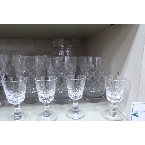 156 - Glassware: to include pedestal wines and tumblers with star cut decoration