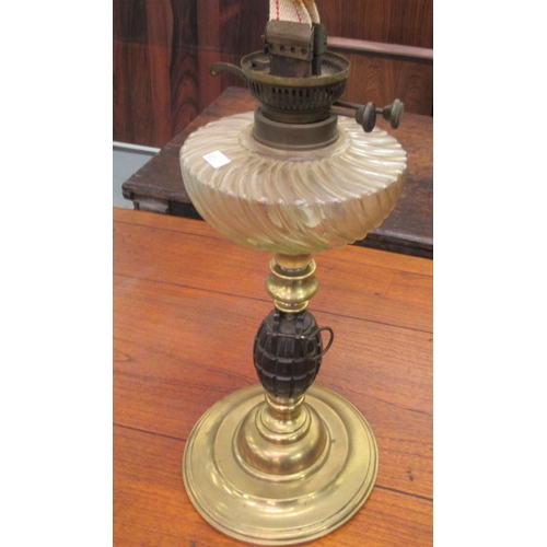 169 - Lamps: to include an example with a glass reservoir and a column, set with a grenade  16