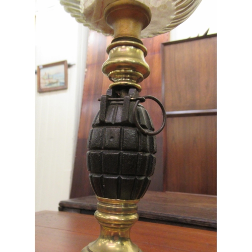 169 - Lamps: to include an example with a glass reservoir and a column, set with a grenade  16