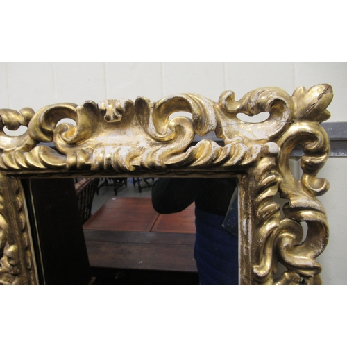 176 - A late 19thC mirror, set in a gilded carved frame  22