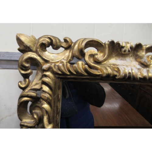 176 - A late 19thC mirror, set in a gilded carved frame  22