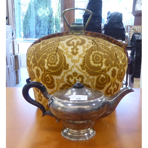 19 - A George V silver teapot of bulbous form on a pedestal foot  Birmingham 1912 with a fabric tea cosy ... 