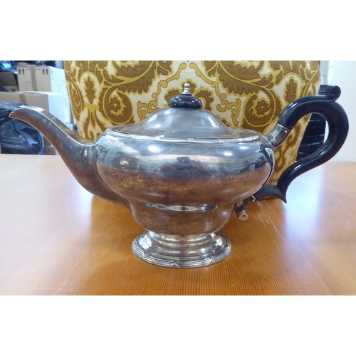 19 - A George V silver teapot of bulbous form on a pedestal foot  Birmingham 1912 with a fabric tea cosy ... 