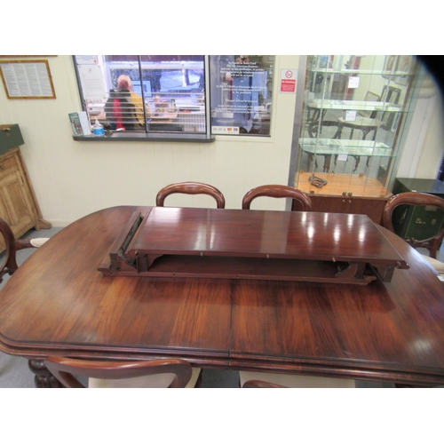 197 - A Victorian style mahogany wind-out dining table, the top comprising a pair of D-ends and two additi... 