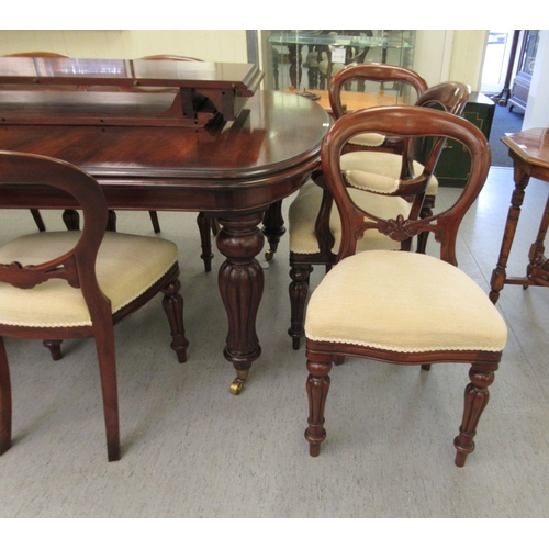 197 - A Victorian style mahogany wind-out dining table, the top comprising a pair of D-ends and two additi... 