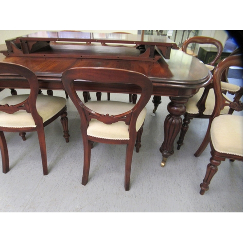 197 - A Victorian style mahogany wind-out dining table, the top comprising a pair of D-ends and two additi... 