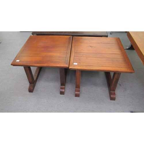 199 - A pair of early 20thC style mahogany side tables with planked tops, raised on square section legs an... 