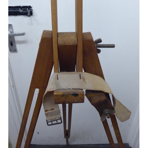 203 - A Windsor & Newton artists' stained beech folding easel, on a tripod stand  76