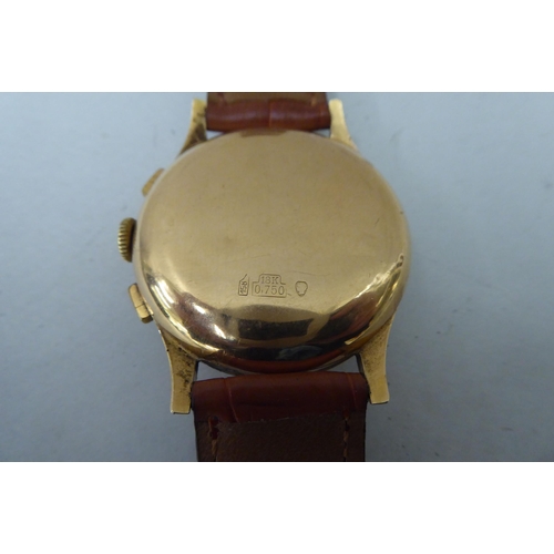 209 - A Chronograph Suisse 18ct gold cased wristwatch, the antimagnetic 17 jewel movement, faced by a silv... 