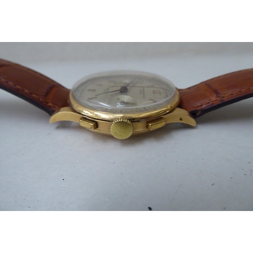 209 - A Chronograph Suisse 18ct gold cased wristwatch, the antimagnetic 17 jewel movement, faced by a silv... 