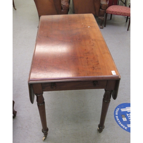 214 - A 19thC style mahogany Pembroke table with an end drawer and facsimile on the reverse, raised on tur... 