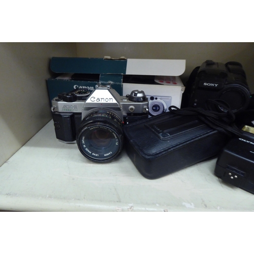 219 - Photographic equipment: to include a Canon AE-1