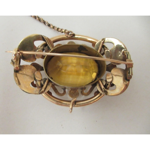 223 - A late Victorian/Edwardian yellow metal framed brooch, set with a citrine coloured stone