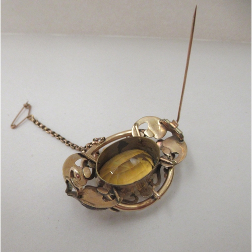 223 - A late Victorian/Edwardian yellow metal framed brooch, set with a citrine coloured stone