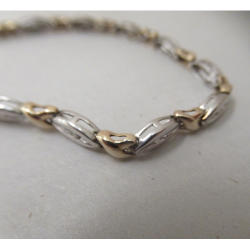 233 - A 9ct bi-coloured gold and diamond set bracelet