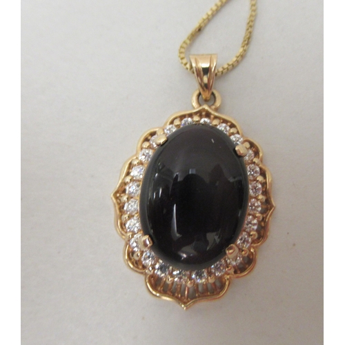 236 - A 14ct gold framed pendant, set with a purple stone and cubic zirconia, on a fine neck chain  s... 