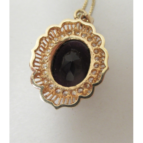 236 - A 14ct gold framed pendant, set with a purple stone and cubic zirconia, on a fine neck chain  s... 