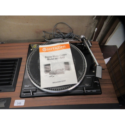 243 - An Hitachi stereo music centre, model no. SDT 7640; and a pair of teak effect cased speakers, model ... 