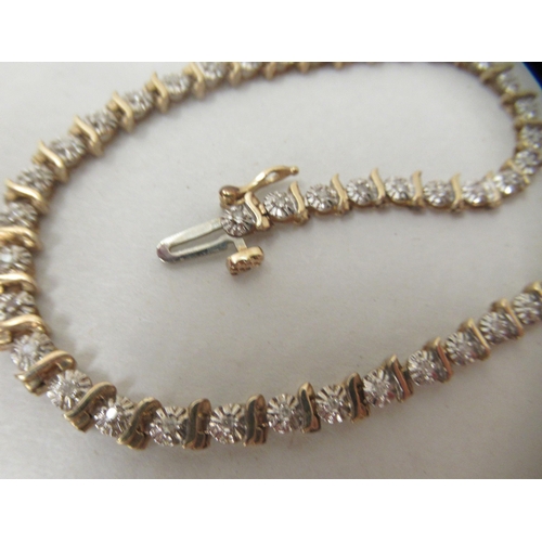 256 - A 9ct gold and diamond set bracelet