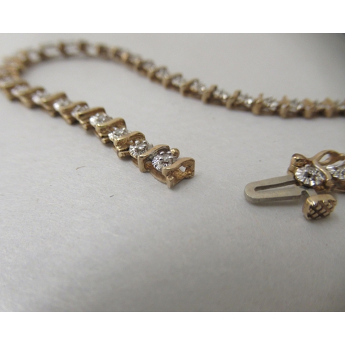 256 - A 9ct gold and diamond set bracelet