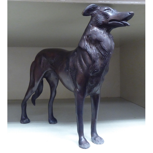 259 - A modern cast bronze model, a dog  6.5