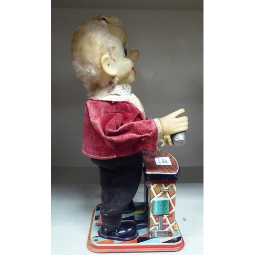 262 - A vintage painted tinplate, battery operated mechanical toy 'The Bartender'  11.5