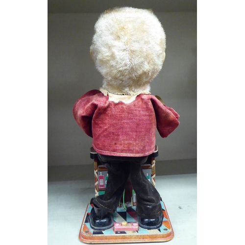 262 - A vintage painted tinplate, battery operated mechanical toy 'The Bartender'  11.5