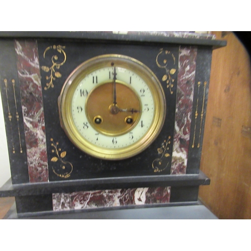 266 - An early 20thC slate and marble cased mantel clock of architectural form, on a plinth; the movement ... 