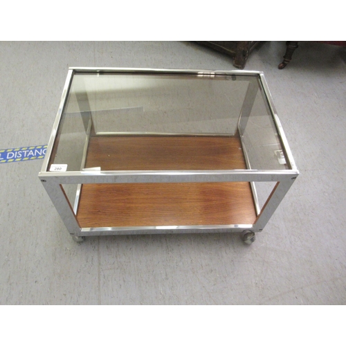 280 - A MDA Product made by Howard Miller, a chromium plated steel framed coffee table with an inset clear... 