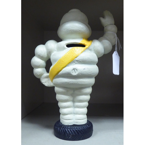 282 - A white, yellow and black painted cast iron figure 'The Michelin Man'  8