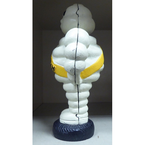 282 - A white, yellow and black painted cast iron figure 'The Michelin Man'  8