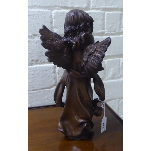 283 - A modern bronze cherubic figure  12