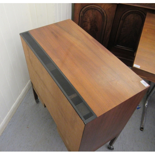 285 - A 1970s rosewood finished record cabinet with a horizontal sliding, tambour front, raised on square ... 