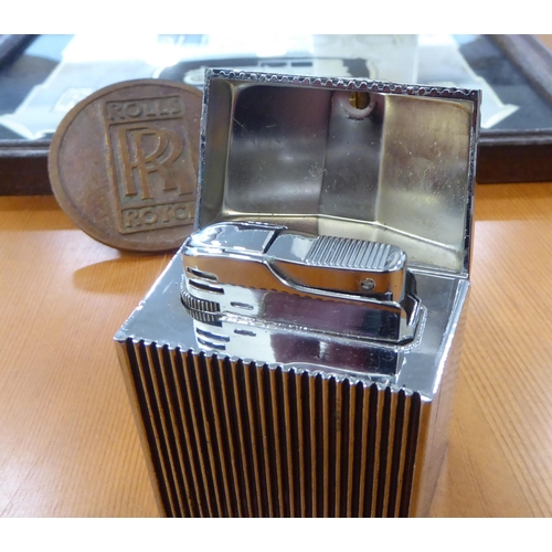 2 - Rolls Royce related collectables: to include a chromium plated table lighter, fashioned as a radiato... 