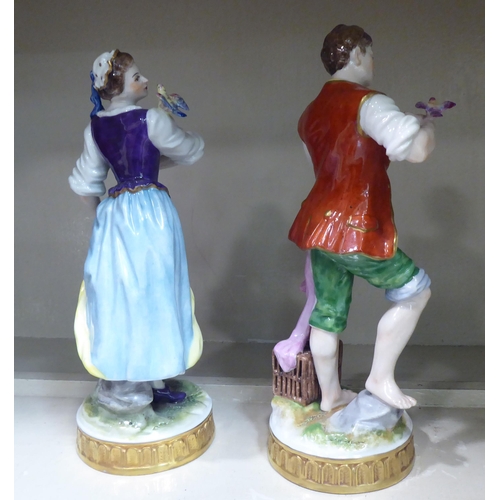 29 - A pair of early 20thC Continental porcelain figures, a man and a woman holding bird cages  8