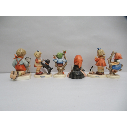 299 - Six Goebel china figures: to include a girl feeding a dog  4