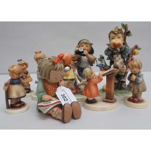 302 - Nine Goebel china figures: to include a girl reading a book  4