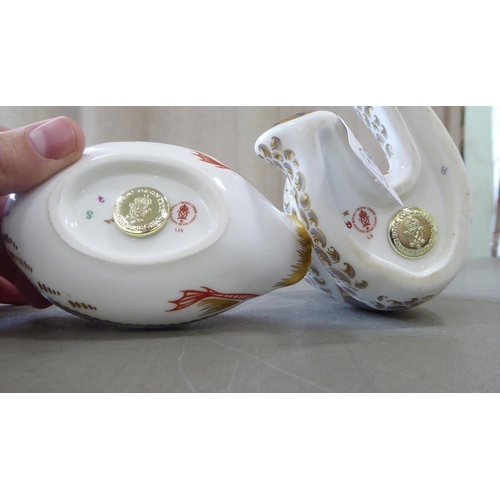 305 - Four Royal Crown Derby china paperweights, each with gilt stoppers: to include a seated Teddy bear&n... 