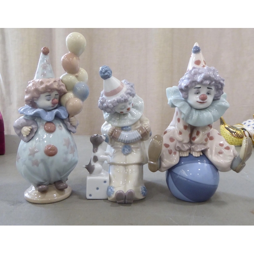 310 - Seven Lladro porcelain clown themed figures: to include one playing a saxaphone  7