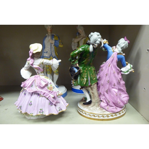 44 - Early 20thC Continental porcelain figures: to include a man and a woman, dancing  10