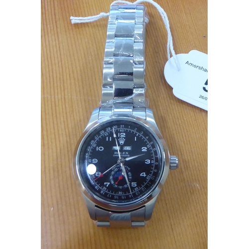 59 - A stainless steel cased and strapped wristwatch 