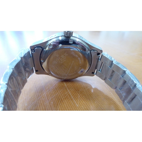 59 - A stainless steel cased and strapped wristwatch 