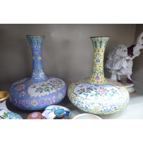 71 - Oriental collectables: to include a pair of mid 20thC Chinese porcelain vases, decorated with flower... 