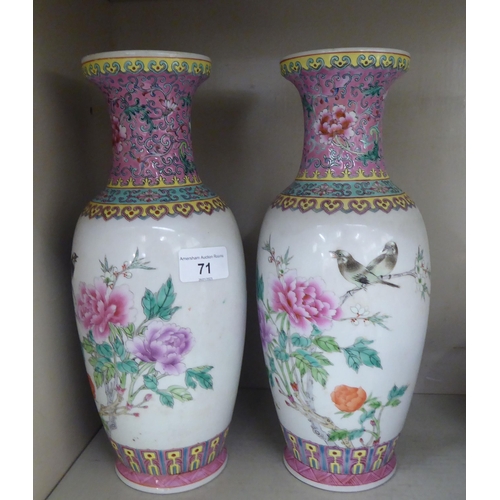 71 - Oriental collectables: to include a pair of mid 20thC Chinese porcelain vases, decorated with flower... 