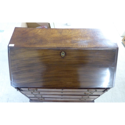 76 - A 19thC ladies mahogany bureau with a fall flap, over four graduated drawers, raised on bracket feet... 