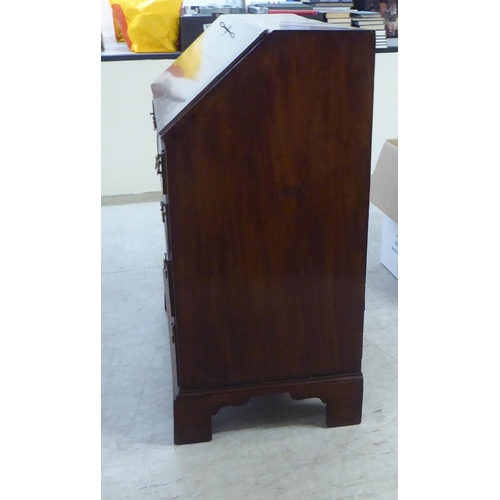 76 - A 19thC ladies mahogany bureau with a fall flap, over four graduated drawers, raised on bracket feet... 