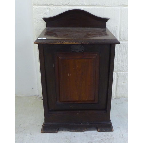 89 - A 20thC early 20thC mahogany purdonium with a fall flap, raised on  bracket feet  24