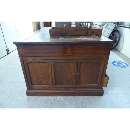 95 - A late 19th/early 20thC mahogany twin pedestal partners desk with an arrangement of eighteen drawers... 