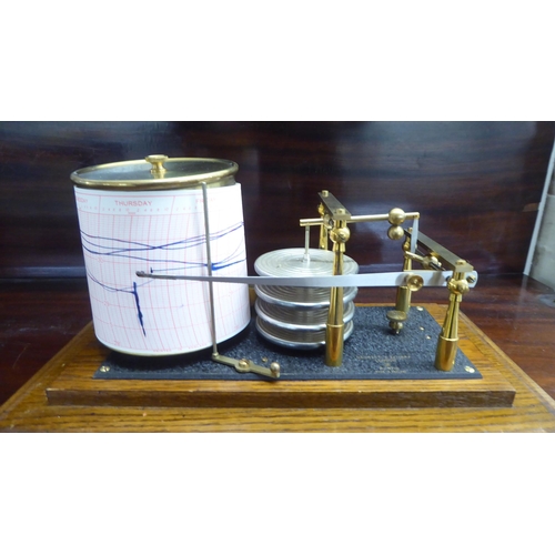 96 - A Negretti and Zambra glazed, oak cased barograph  No.9710  6.5